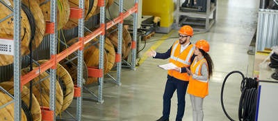 Workers auditing a warehouse