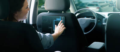 A passenger in an autonomous taxi