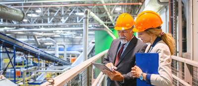 Manager and quality controller inside recycling facility.