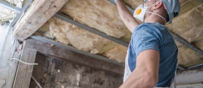 Replacing old attic mineral wool insulation.