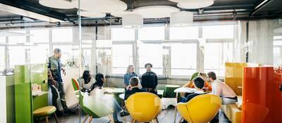 Young business professionals sitting on modern furniture