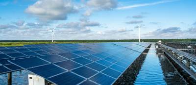 The solar photovoltaic power station on the water surface and the wind turbine in the distance.