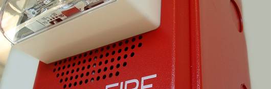 Close-up of fire alarm with speaker and strobe