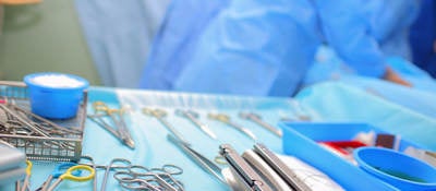 Sterile surgical equipment laid out on a tray in an operating room 